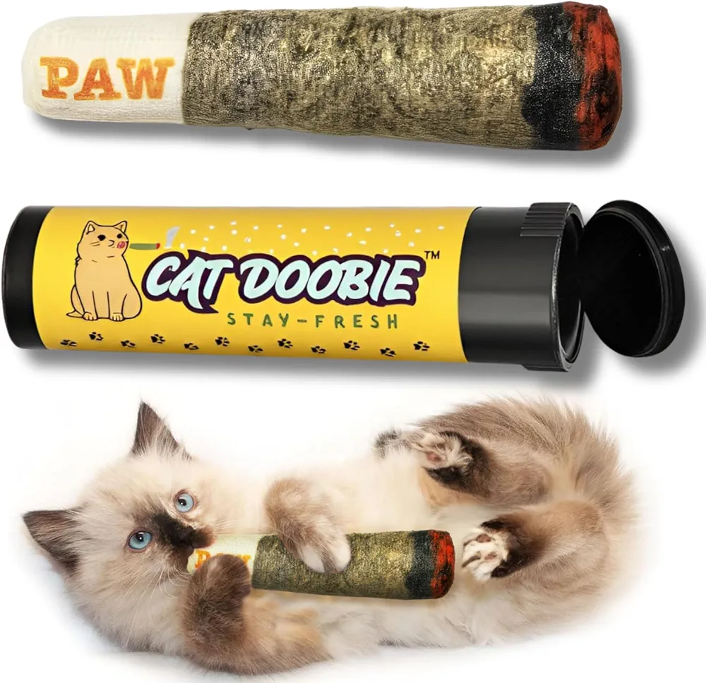 A cylindrical catnip toy product displayed in three views: the PAW brand wrapped toy at top, the yellow Cat Doobie Stay-Fresh packaging tube in the middle, and two kittens playing with the textured olive and red toy at the bottom.